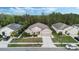 Aerial view of a home's exterior elevation showcasing its well-manicured lawn and landscaping at 3893 Wind Dancer Cir, St Cloud, FL 34772
