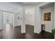 Hallway with wood-look tile flooring connecting various living spaces at 3893 Wind Dancer Cir, St Cloud, FL 34772