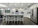 Modern kitchen with stainless steel appliances, a large island with seating, pendant lighting, and stylish backsplash at 3893 Wind Dancer Cir, St Cloud, FL 34772