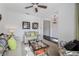 Cozy living room with neutral colored walls, decorative throw pillows, and a ceiling fan at 3893 Wind Dancer Cir, St Cloud, FL 34772