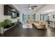Bright living room with a large sectional sofa and entertainment area at 3893 Wind Dancer Cir, St Cloud, FL 34772