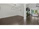 Spacious living room with wood-look tile flooring and open layout at 3893 Wind Dancer Cir, St Cloud, FL 34772