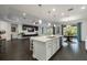 Open concept living space with kitchen island and adjacent Gathering area at 3893 Wind Dancer Cir, St Cloud, FL 34772