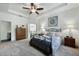 Main bedroom features a tray ceiling, ceiling fan, and an ensuite bathroom with a separate water closet at 3893 Wind Dancer Cir, St Cloud, FL 34772