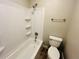 Bathroom featuring a bathtub with shower and storage shelves at 3922 Crayrich Cir # C-4, Orlando, FL 32839