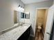 Primary bathroom featuring a granite vanity and attached toilet at 3922 Crayrich Cir # C-4, Orlando, FL 32839