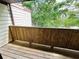 Outdoor wooden deck featuring wood siding and trees in background at 3922 Crayrich Cir # C-4, Orlando, FL 32839