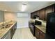 Kitchen featuring granite countertops, modern appliances and lots of cabinets at 3922 Crayrich Cir # C-4, Orlando, FL 32839