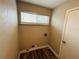 Laundry area with hardwood floors and large window at 3922 Crayrich Cir # C-4, Orlando, FL 32839