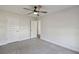 Neutral bedroom has carpet and white doors at 442 Big Black Pl, Kissimmee, FL 34759