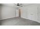 Bedroom includes ceiling fan and carpet at 442 Big Black Pl, Kissimmee, FL 34759