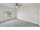 Neutral bedroom features include a window and ceiling fan at 442 Big Black Pl, Kissimmee, FL 34759