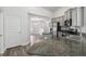 The kitchen features granite countertops, stainless steel appliances, and hardwood-style floors that are adjacent to the dining room at 442 Big Black Pl, Kissimmee, FL 34759
