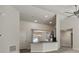 Spacious living room view to the kitchen with granite countertops, stainless steel appliances, and hardwood floors at 442 Big Black Pl, Kissimmee, FL 34759