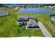 Aerial view of a two-story home, showcasing its generous lot size and nearby lake at 4512 Cutwater Dr, Orlando, FL 32820
