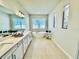 Bright bathroom featuring a soaking tub, walk-in shower, double vanity, and neutral tones at 4512 Cutwater Dr, Orlando, FL 32820
