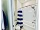 Bathroom features a toilet, shower/tub combo, and blue and white striped shower curtain at 4512 Cutwater Dr, Orlando, FL 32820