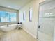 Bathroom featuring a soaking tub, walk-in shower, and neutral tones at 4512 Cutwater Dr, Orlando, FL 32820
