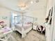 Bedroom with a canopy bed, soft lighting, and whimsical decorations at 4512 Cutwater Dr, Orlando, FL 32820