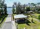 Picturesque community area featuring a covered picnic area, a dock, and lush landscaping by the lake at 4512 Cutwater Dr, Orlando, FL 32820