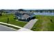 Stunning home with manicured lawn, long driveway, and beautiful lake view providing an ideal setting at 4512 Cutwater Dr, Orlando, FL 32820