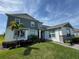 Charming two-story home with well-maintained lawn and stone accents at 4512 Cutwater Dr, Orlando, FL 32820