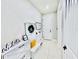 Bright foyer with white storage bench, coat rack and decorations at 4512 Cutwater Dr, Orlando, FL 32820