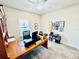 Bright home office featuring a ceiling fan and a charming wood desk at 4512 Cutwater Dr, Orlando, FL 32820