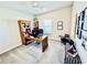 Home office space with vaulted ceilings, ceiling fan, and a charming wood desk at 4512 Cutwater Dr, Orlando, FL 32820