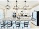 Kitchen features island with bar stool seating, granite counters, and stainless appliances at 4512 Cutwater Dr, Orlando, FL 32820