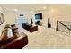 Spacious living room area with plush carpeting, large-screen TV, and comfortable seating at 4512 Cutwater Dr, Orlando, FL 32820