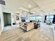 Open-concept living area with fireplace, custom built-ins, and sliding glass doors leading to the patio at 4512 Cutwater Dr, Orlando, FL 32820