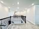 Spacious loft area with dark wrought iron railings at 4512 Cutwater Dr, Orlando, FL 32820