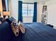Close up of the main bedroom with a large, comfortable bed and bright water views at 4512 Cutwater Dr, Orlando, FL 32820