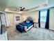 The bright main bedroom features a tray ceiling, ceiling fan, neutral decor and en-suite bath at 4512 Cutwater Dr, Orlando, FL 32820