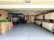 Spacious garage with ample storage cabinets and epoxy flooring, perfect for organization and workspace at 4638 River Ridge Dr, Leesburg, FL 34748