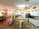 Inviting kitchen with a breakfast bar, open layout, and stylish countertops at 4638 River Ridge Dr, Leesburg, FL 34748