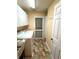 Laundry room with a washing machine, dryer, and cabinets for storage at 4638 River Ridge Dr, Leesburg, FL 34748