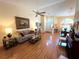 Bright living room features lots of light, wood floors, and vaulted ceilings at 4638 River Ridge Dr, Leesburg, FL 34748