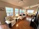 Cozy sunroom with a full wall of windows, perfect for relaxing and enjoying the view at 4638 River Ridge Dr, Leesburg, FL 34748