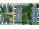 Aerial view of townhome community featuring multiple units with parking spaces and lush landscaping at 4730 Capital Blvd, St Cloud, FL 34769