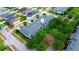 An aerial view of townhouse community with lush trees and well-maintained landscaping at 4730 Capital Blvd, St Cloud, FL 34769