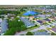 Overhead view of townhome community highlighting lush trees and well-maintained landscaping at 4730 Capital Blvd, St Cloud, FL 34769