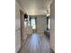 Bedroom with hard wood floors and two windows at 4730 Capital Blvd, St Cloud, FL 34769