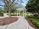 A view of pathway leading to a gazebo in a park at 4730 Capital Blvd, St Cloud, FL 34769