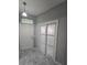 Bright entryway with tiled floors, closet, and door at 4730 Capital Blvd, St Cloud, FL 34769