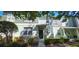 Charming two-story townhome with stone accents, a welcoming entrance, and well-maintained landscaping at 4730 Capital Blvd, St Cloud, FL 34769
