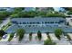 An aerial view of townhomes with garage parking and manicured landscaping at 4730 Capital Blvd, St Cloud, FL 34769
