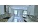 Contemporary kitchen featuring stainless steel appliances, granite countertops, and stylish backsplash at 4730 Capital Blvd, St Cloud, FL 34769