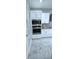 Modern kitchen design featuring stainless steel appliances and white cabinets at 4730 Capital Blvd, St Cloud, FL 34769
